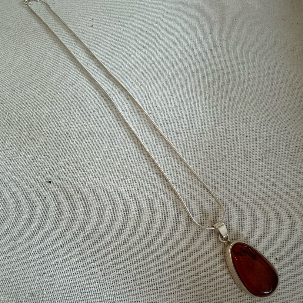 Sterling Silver Snake Chain with Amber Teardrop Pendant.